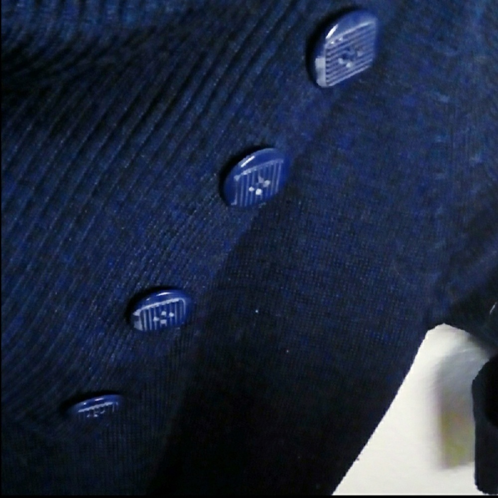 Figure hugging blue triangle button collar sweater